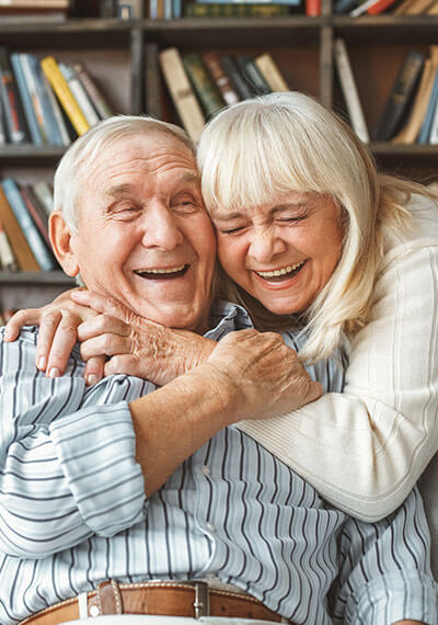 Senior couple embrace and laugh